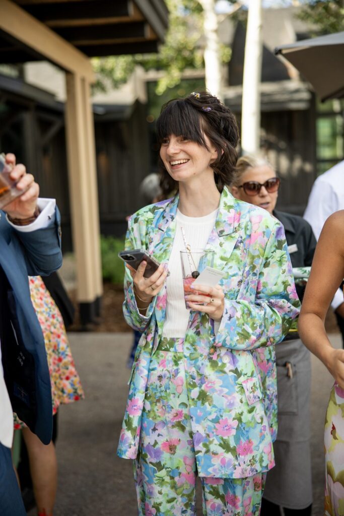 colorful floral pantsuit as summer wedding guest attire at an aspen wedding, playful alternative to a dress